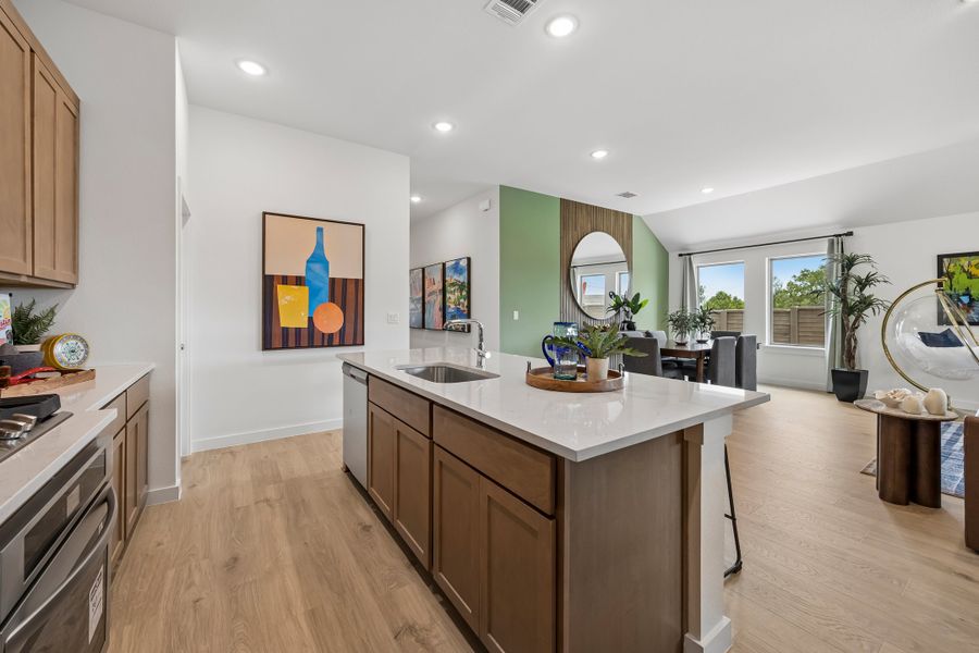 Kitchen in the Pecos home plan by Trophy Signature Homes – REPRESENTATIVE PHOTO