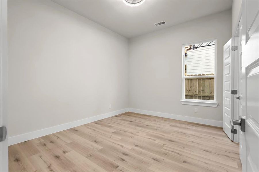 Empty room featuring light hardwood / wood-style floors