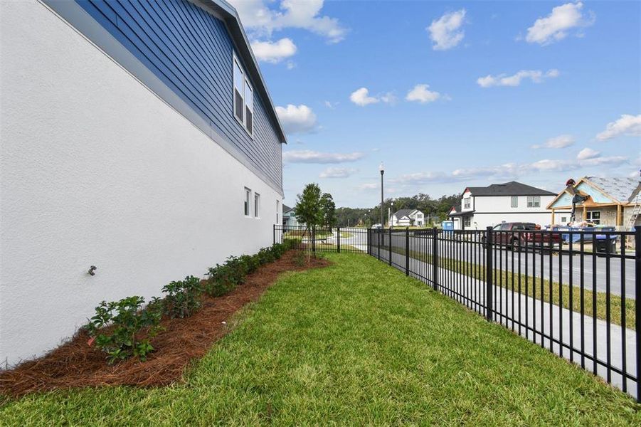 Exterior details and patio area of a home in Oakfield at Mount Dora Village Series, Mount Dora (Image 24).