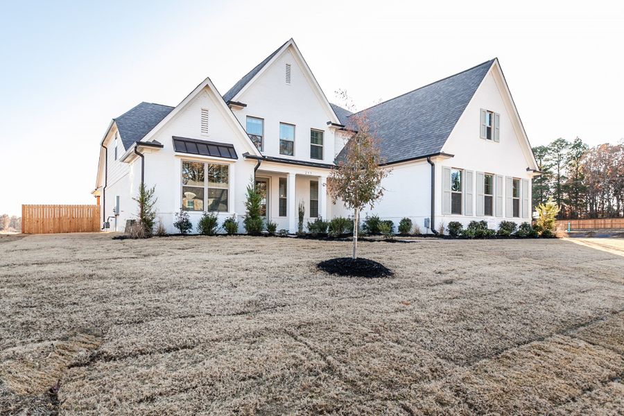 Representative exterior photo of a completed home built from the Bentley by Grant & Co in Manor at Hall Creek, Arlington, TN (Image 23).