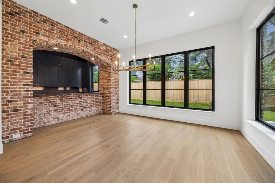 Charming dining room overlooking backyard.