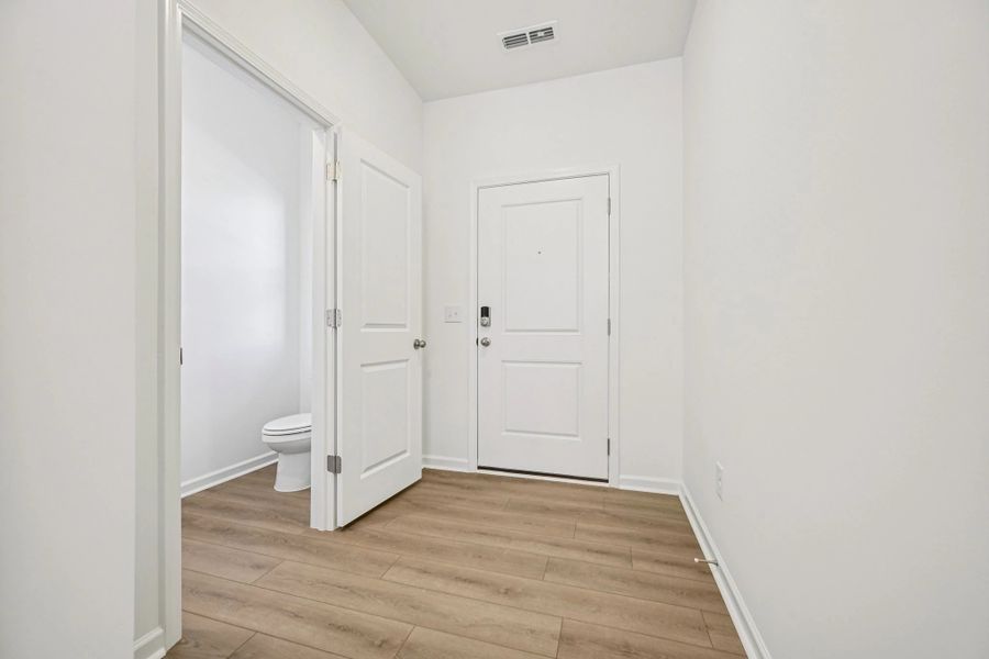 Foyer featuring the AW Collection® Timeless - A refined welcome with soft light and style.