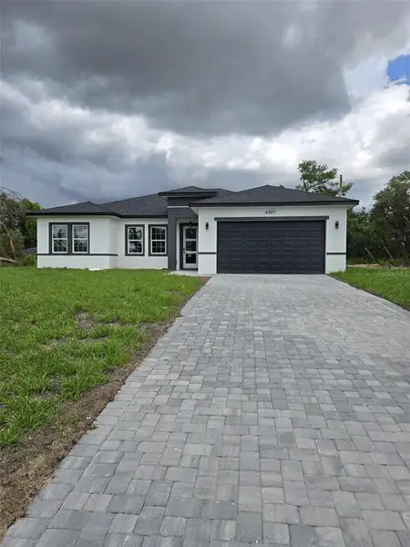 Front exterior of a new home in , Ocala, FL, highlighting curb appeal (Image 1). Front exterior of a new home in , Ocala, FL, highlighting curb appeal (Image 1).