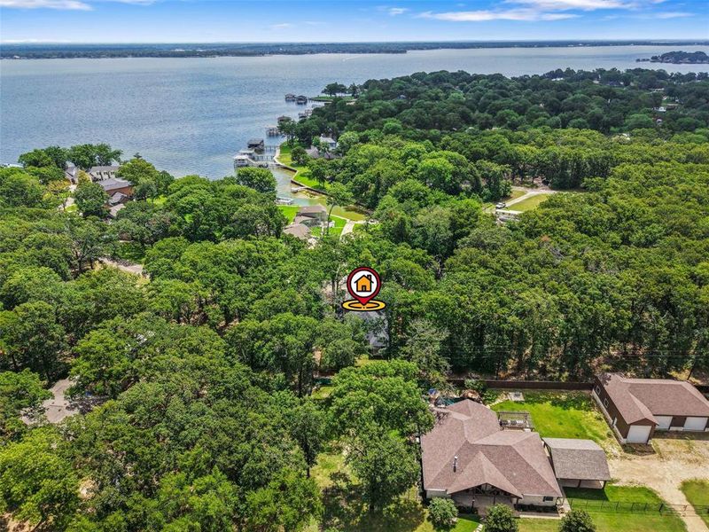 Extensive wooded property with a prominent water feature in the background Extensive wooded property with a prominent water feature in the background