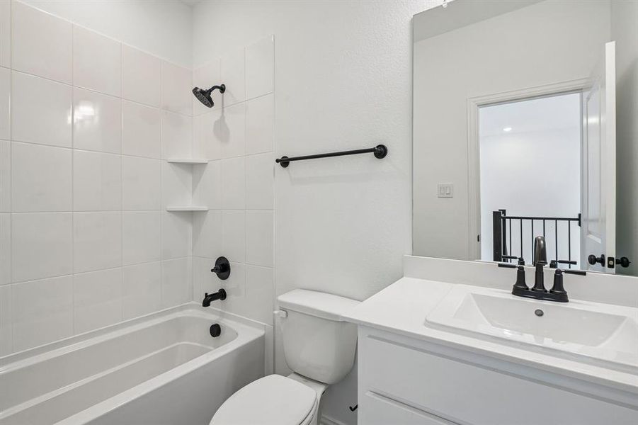 Crisp, clean and white with dark accents, this guest bath is a winner! Crisp, clean and white with dark accents, this guest bath is a winner!