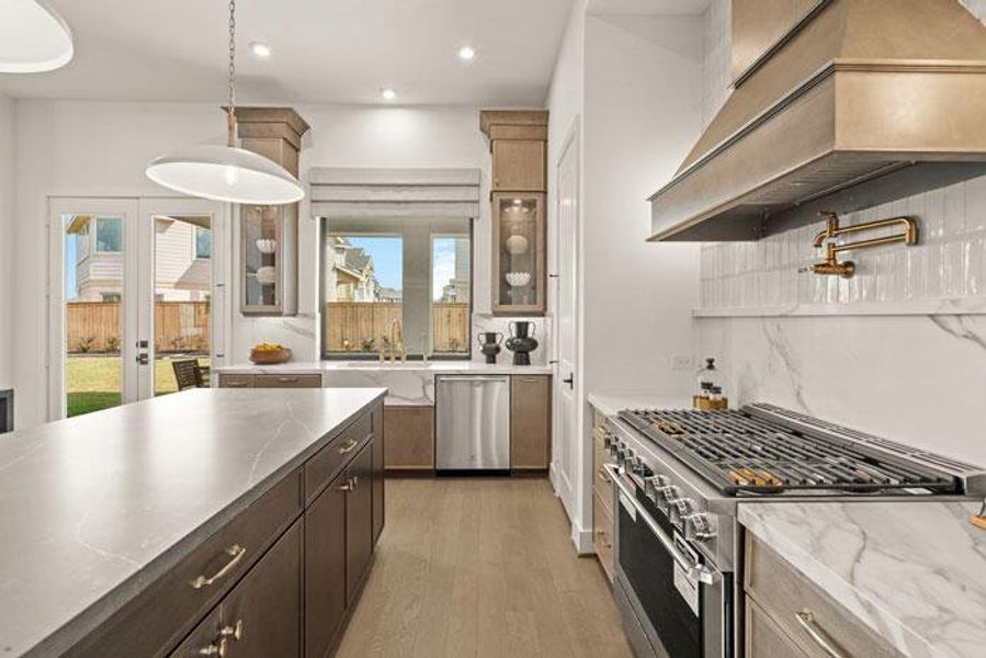 The gourmet kitchen with a sink that overlooks your covered patio. Representative image.