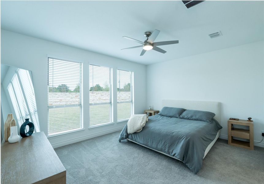Bedroom featuring carpet floors and ceiling fan