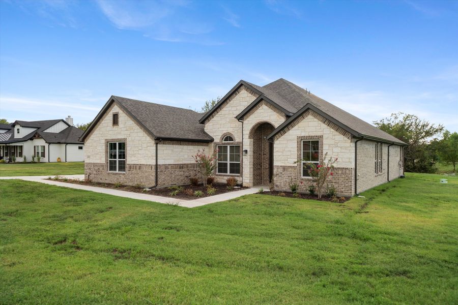 Front exterior of a new home in Vista Oaks Estates, Royse City, TX, highlighting curb appeal (Image 24).