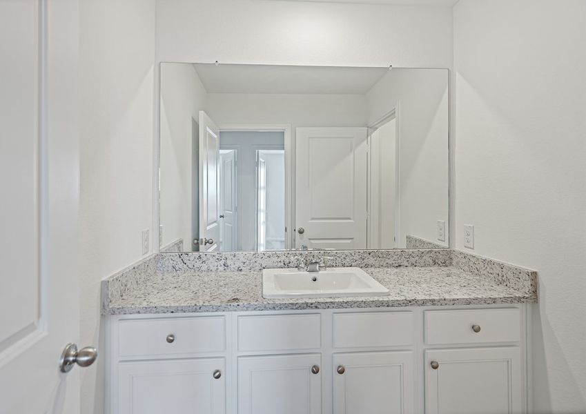 Secondary bathroom with a long sink vanity