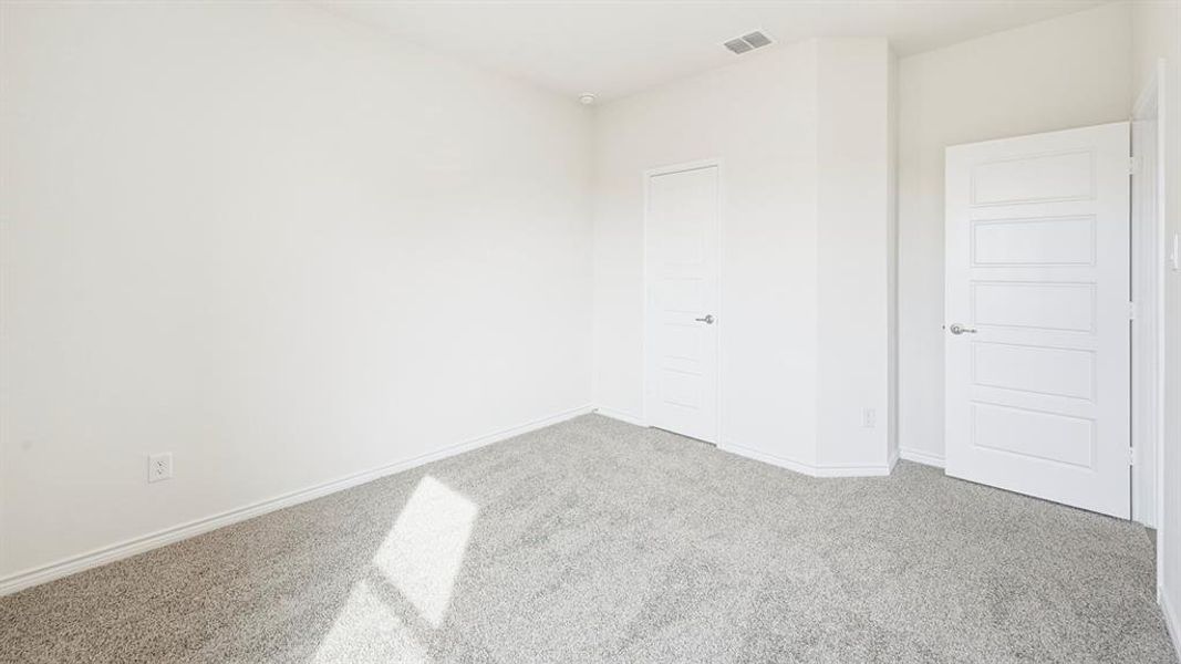Unfurnished bedroom featuring carpet floors and baseboards