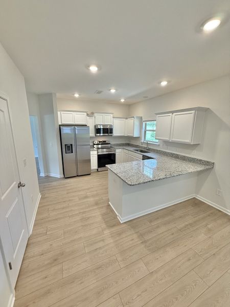 Furnished interior view inside a new home in Stone Fort Meadows, Manchester (Image 3).