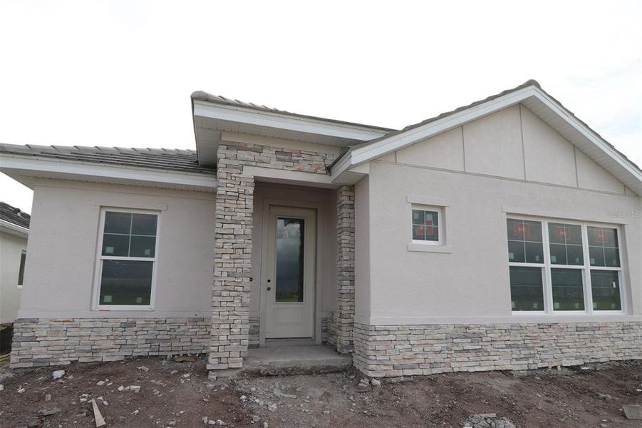 Exterior details and patio area of a home in Vistera of Venice – Cottage Series, Nokomis (Image 2).