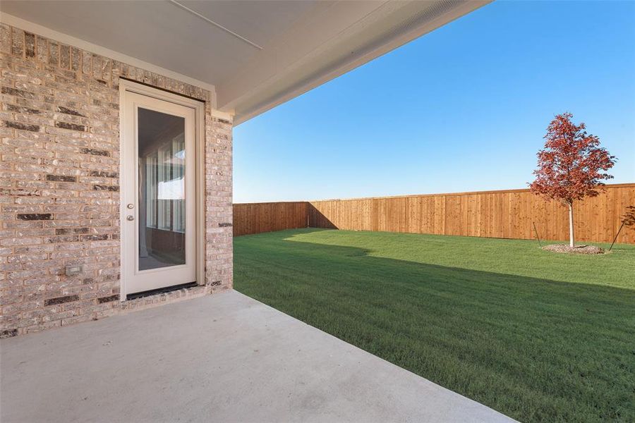 Exterior details and patio area of a home in Wildflower Ranch, Justin (Image 3).
