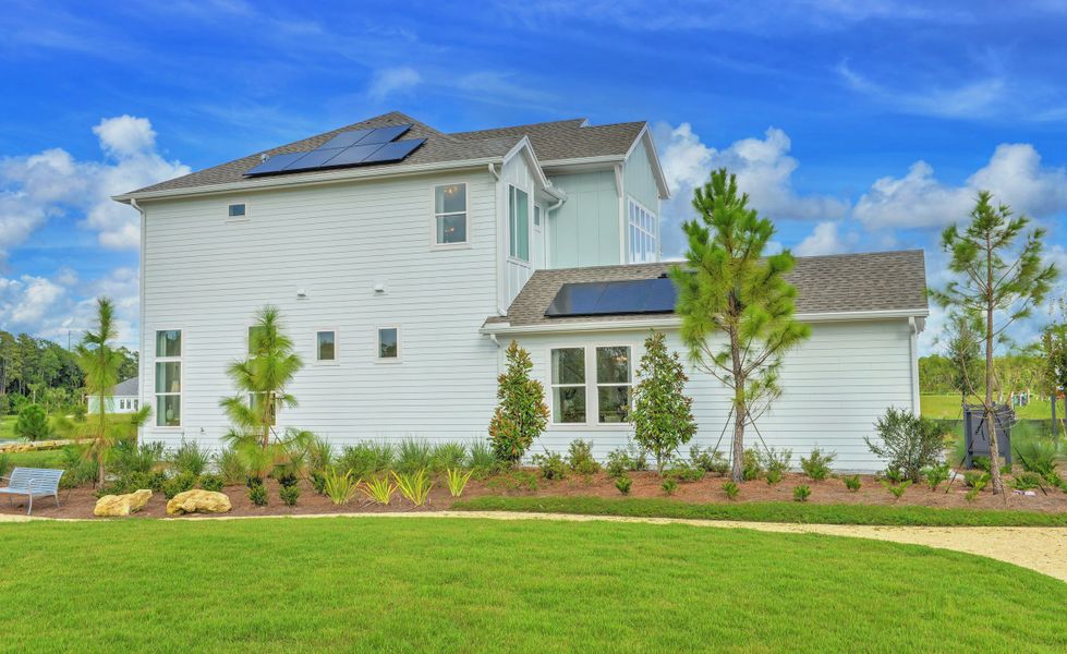 Front exterior of a new home in Weslyn Park at Sunbridge, St. Cloud, FL, highlighting curb appeal (Image 2).