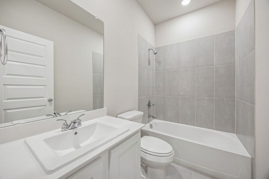 Bathroom in the Wimbledon home plan by Trophy Signature Homes – REPRESENTATIVE PHOTO