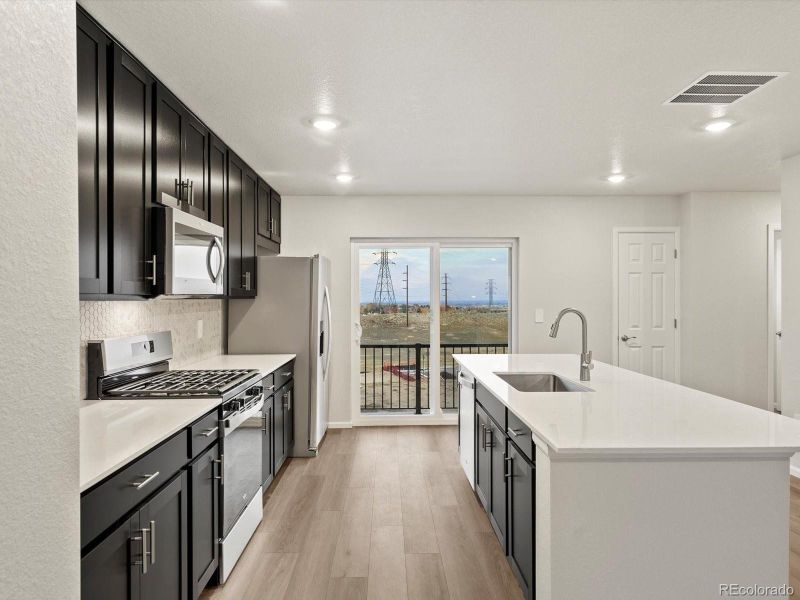 Furnished interior view inside a new home in Three Hills, Morrison (Image 4).