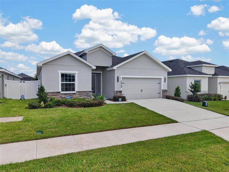 Front exterior of a new home in , Davenport, FL, highlighting curb appeal (Image 32).