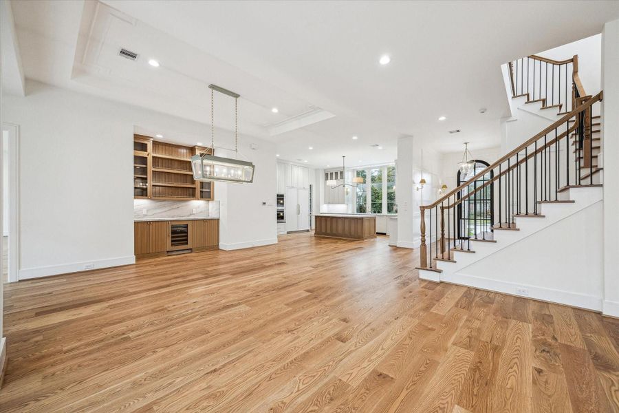 Another view of open floor plan with gorgeous Staircase with upper windows allowing great natural light! Another view of open floor plan with gorgeous Staircase with upper windows allowing great natural light!
