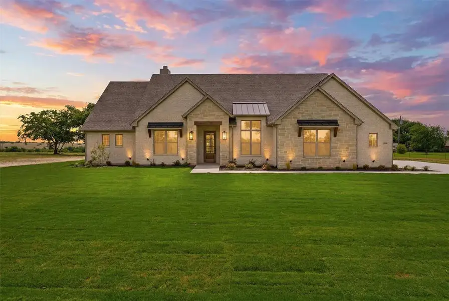 Front exterior of a new home in , Godley, TX, highlighting curb appeal (Image 1). Front exterior of a new home in , Godley, TX, highlighting curb appeal (Image 1).