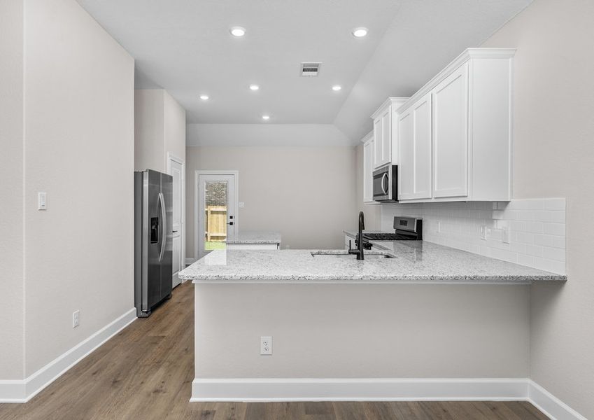 The dining room sits right off of the kitchen. The dining room sits right off of the kitchen.