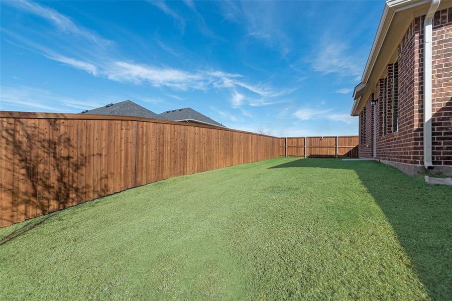 Exterior details and patio area of a home in Walden Pond, Forney (Image 4).