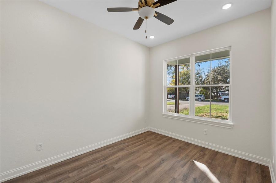 Spare room featuring dark wood finished floors, recessed lighting, and a ceiling fan Spare room featuring dark wood finished floors, recessed lighting, and a ceiling fan