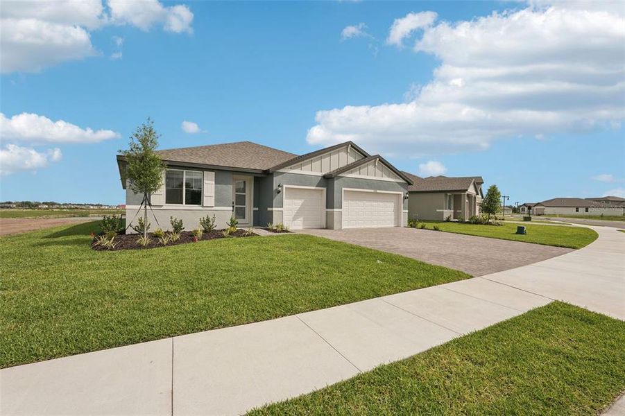 Front exterior of a new home in Oakfield Trails - Signature Series, Parrish, FL, highlighting curb appeal (Image 20).