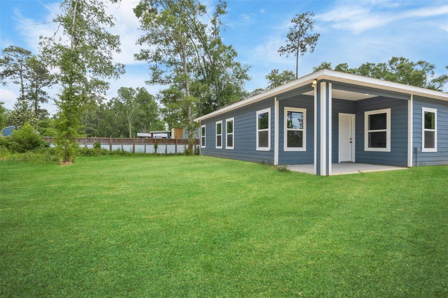 Exterior details and patio area of a home in , Splendora (Image 3).