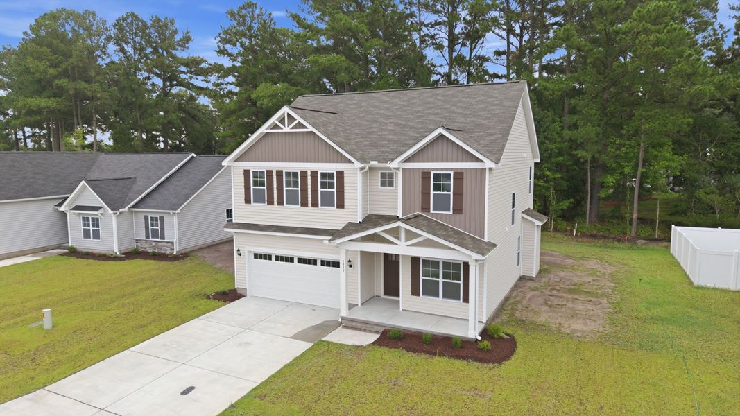 Front exterior of a new home in Davenport Farms, Winterville, NC, highlighting curb appeal (Image 22). Front exterior of a new home in Davenport Farms, Winterville, NC, highlighting curb appeal (Image 22).