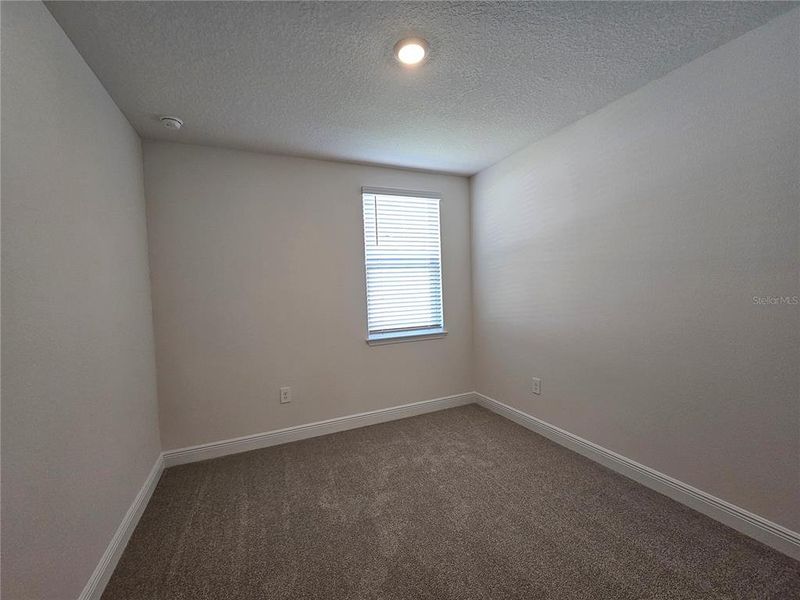 Spacious, unfurnished interior of a new home in The Reserve at Hammock Oaks - Signature Series, Lady Lake (Image 28).