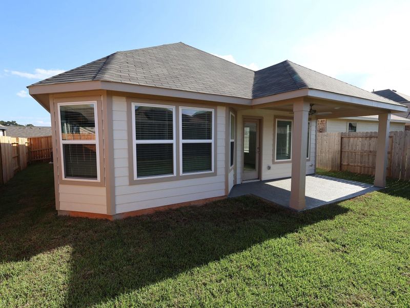 Exterior details and patio area of a home in Moran Ranch, Willis (Image 15). Exterior details and patio area of a home in Moran Ranch, Willis (Image 15).