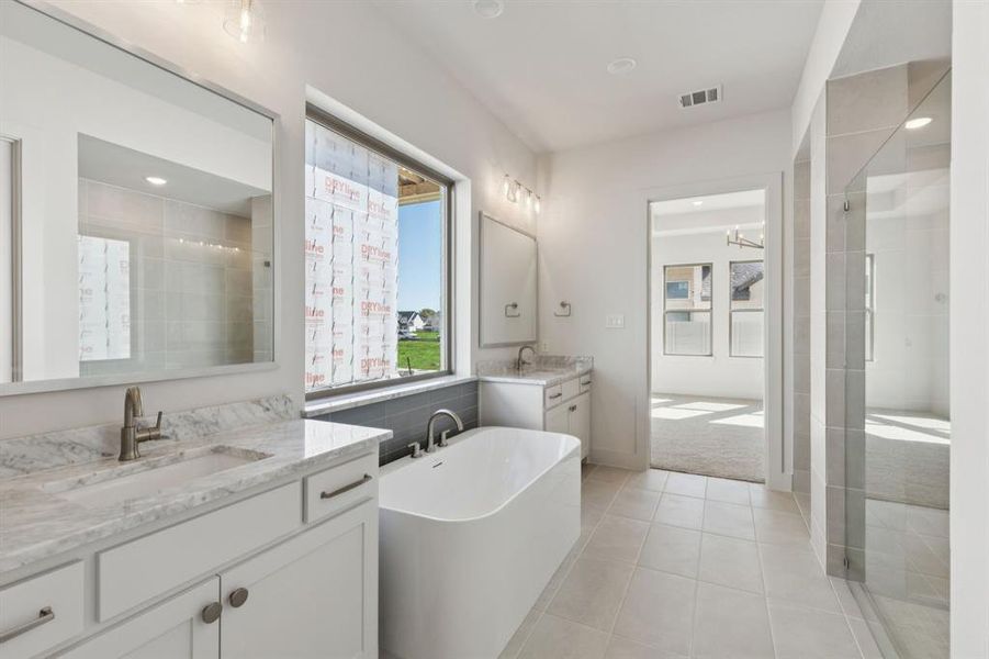 No shortage of space or style in this beautiful owner's bath!