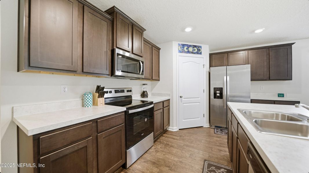 Furnished interior view inside a new home in River Glen Express, Yulee (Image 9).