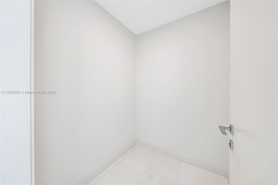 Spacious, unfurnished interior of a new home in Aston Martin Residences, Miami (Image 13).