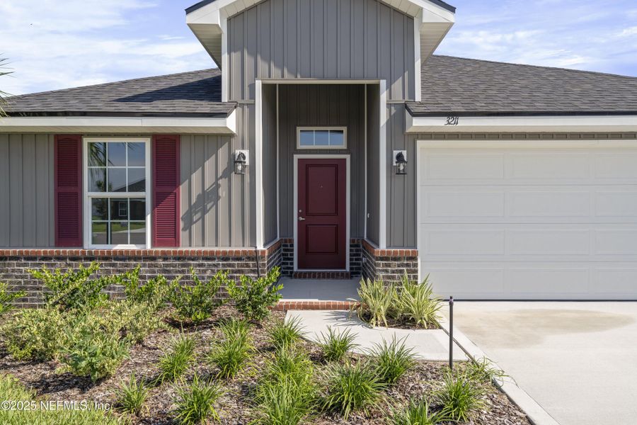 Front exterior of a new home in Shadow Crest at Rolling Hills, Green Cove Springs, FL, highlighting curb appeal (Image 15).