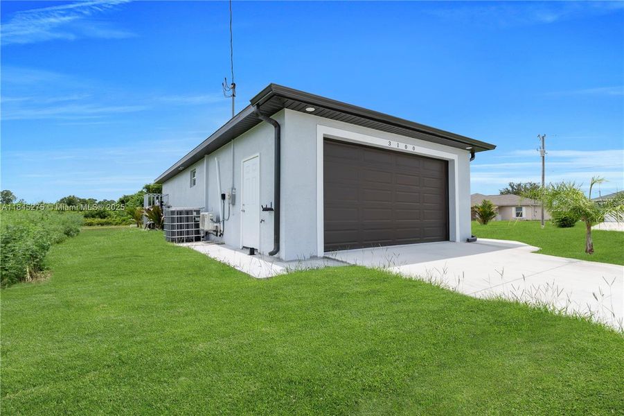 Front exterior of a new home in , Lehigh Acres, FL, highlighting curb appeal (Image 19).
