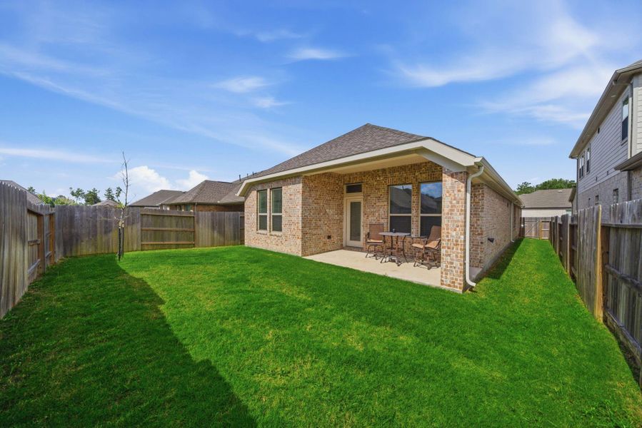 Exterior details and patio area of a home in Artavia, Conroe (Image 3).