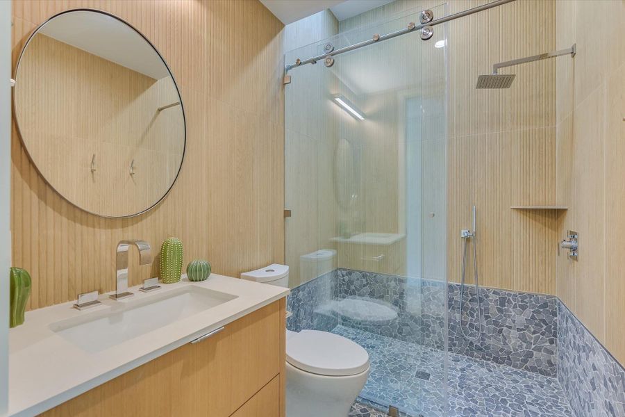 Full bathroom featuring walk in shower and vanity
