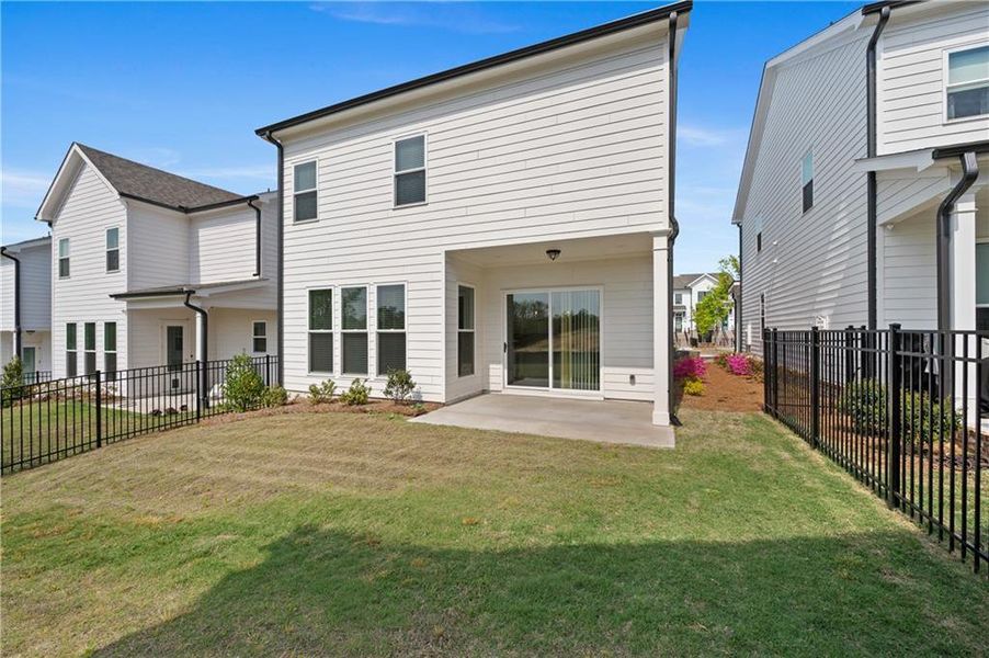 Exterior details and patio area of a home in Palisades Single Family, Cumming (Image 27).