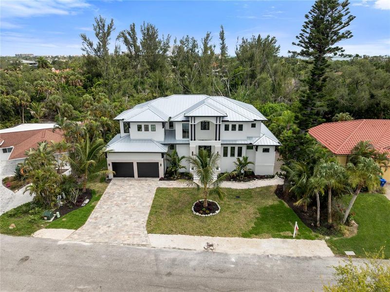 Front exterior of a new home in , Longboat Key, FL, highlighting curb appeal (Image 32). Front exterior of a new home in , Longboat Key, FL, highlighting curb appeal (Image 32).