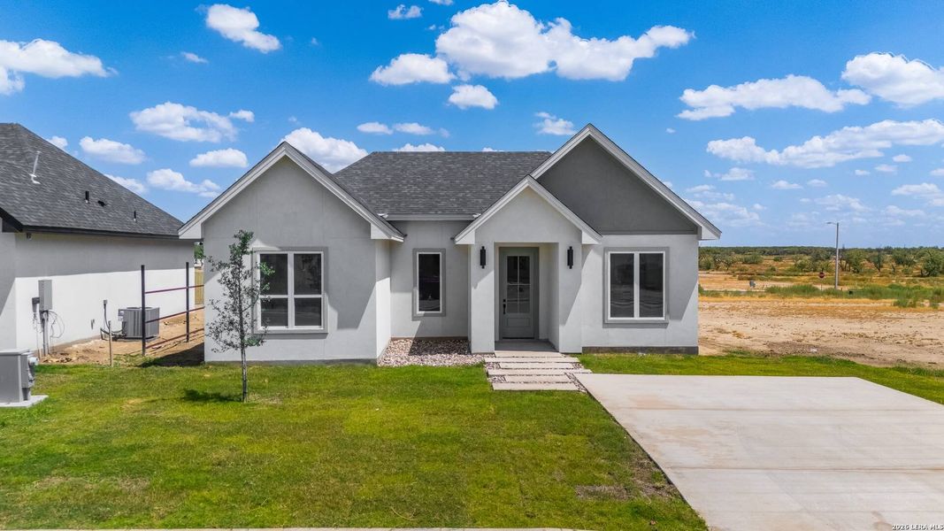 Front exterior of a new home in , Eagle Pass, TX, highlighting curb appeal (Image 2). Front exterior of a new home in , Eagle Pass, TX, highlighting curb appeal (Image 2).
