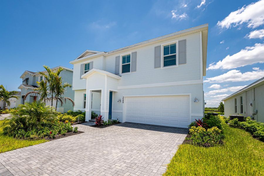 Front exterior of a new home in , Fort Pierce, FL, highlighting curb appeal (Image 2). Front exterior of a new home in , Fort Pierce, FL, highlighting curb appeal (Image 2).
