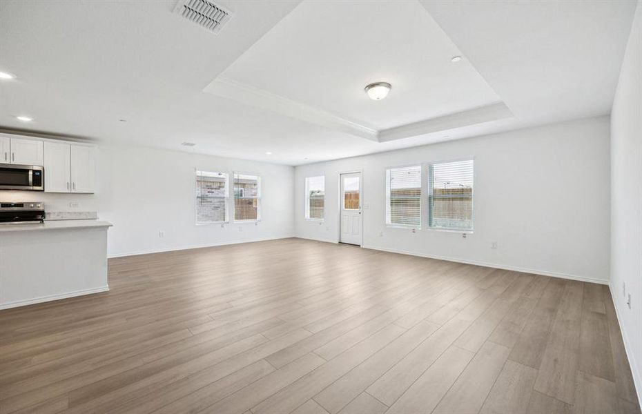 Expansive gathering room bathed in natural sunlight *Real home pictured Expansive gathering room bathed in natural sunlight *Real home pictured