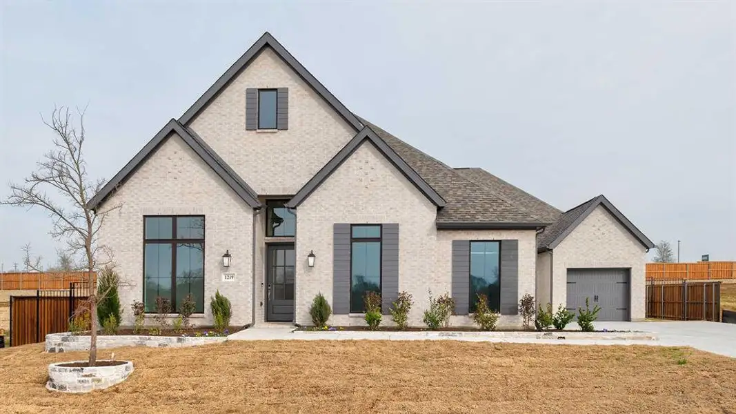 Front exterior of a new home in Lakewood Village, Lakewood Village, TX, highlighting curb appeal (Image 1). Front exterior of a new home in Lakewood Village, Lakewood Village, TX, highlighting curb appeal (Image 1).