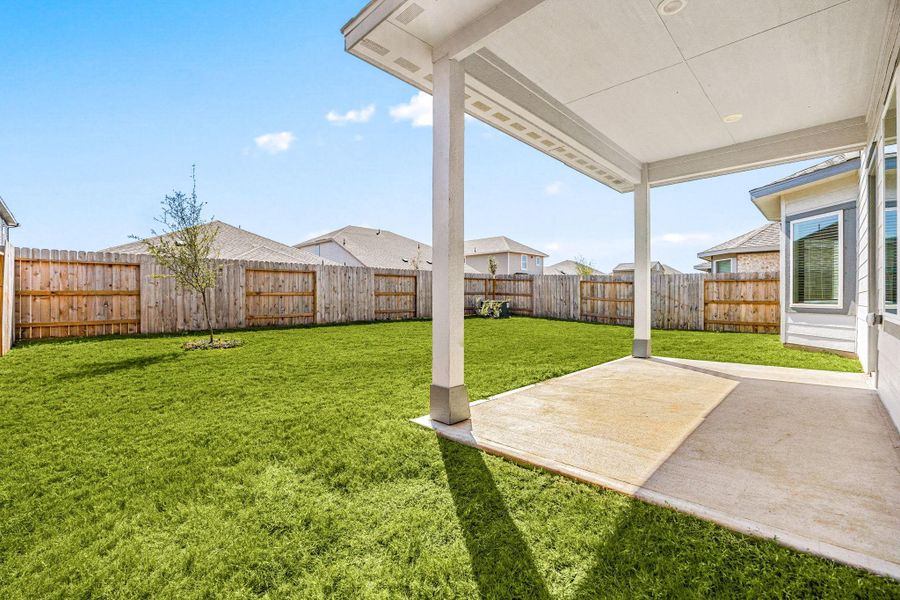 Enjoy outdoor living on the spacious covered rear patio, the perfect setting for relaxing or entertaining, no matter the weather. Enjoy outdoor living on the spacious covered rear patio, the perfect setting for relaxing or entertaining, no matter the weather.