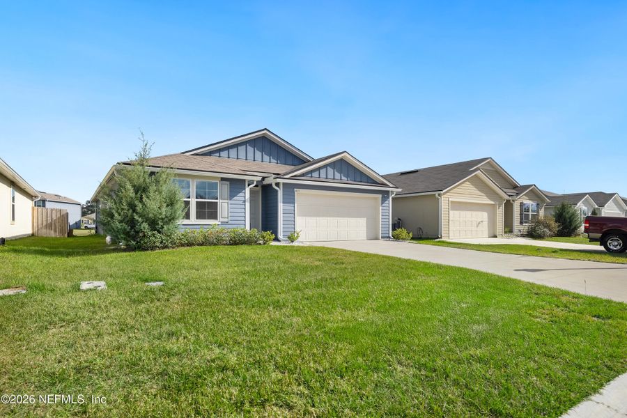 Front exterior of a new home in Copes Landing, Jacksonville, FL, highlighting curb appeal (Image 22). Front exterior of a new home in Copes Landing, Jacksonville, FL, highlighting curb appeal (Image 22).