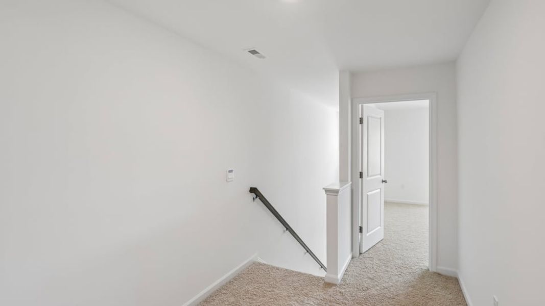 Spacious, unfurnished interior of a new home in The Townes at Belle Grove, Wendell (Image 9).