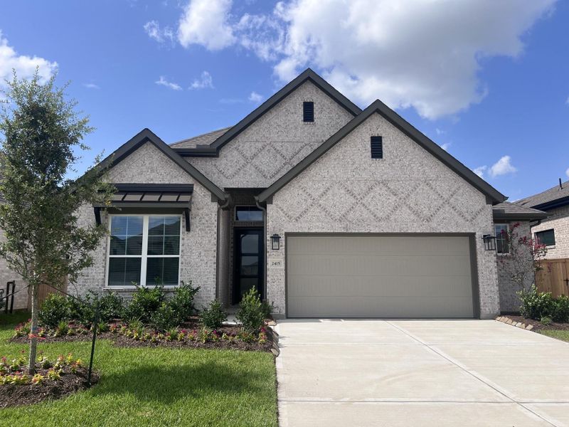 Front exterior of a new home in Wood Leaf Reserve, Tomball, TX, highlighting curb appeal (Image 1). Front exterior of a new home in Wood Leaf Reserve, Tomball, TX, highlighting curb appeal (Image 1).