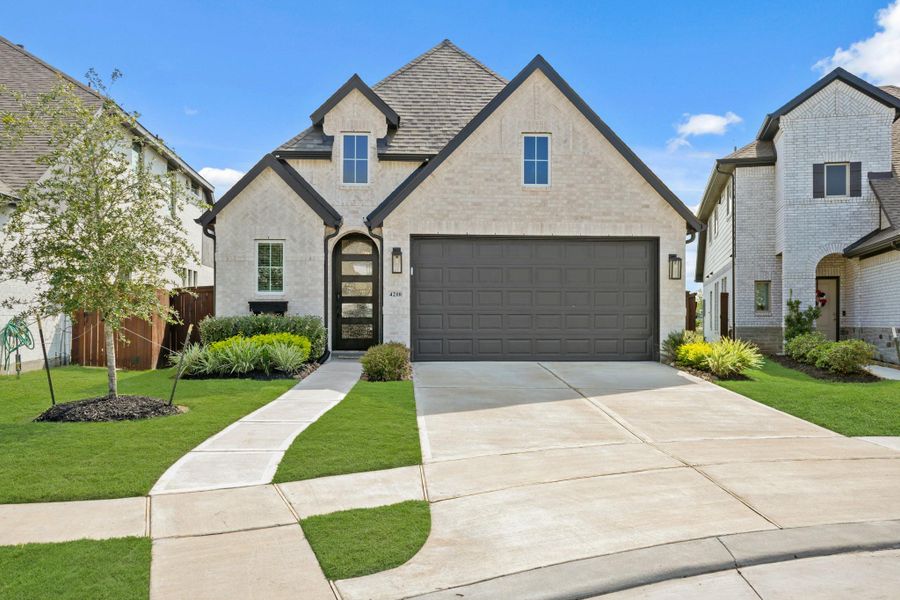 Front exterior of a new home in , Rosharon, TX, highlighting curb appeal (Image 19).