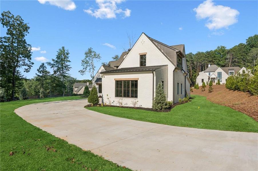 Front exterior of a new home in , Cumming, GA, highlighting curb appeal (Image 23).